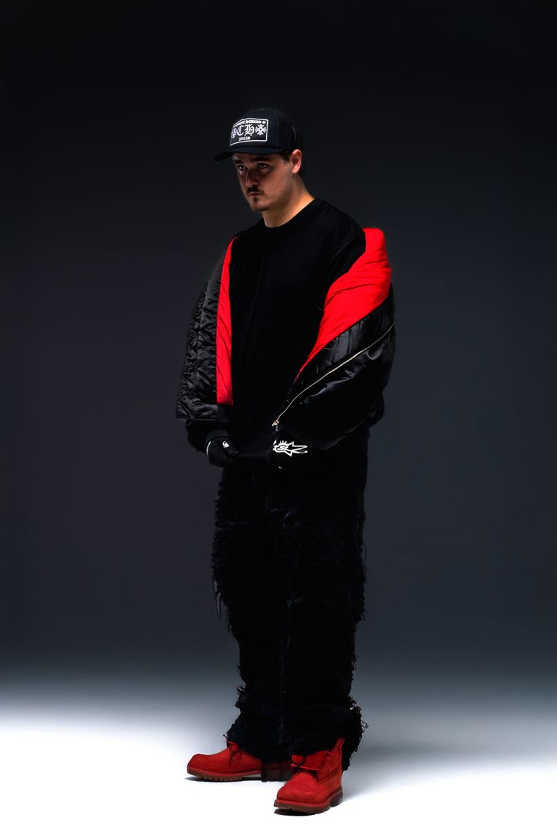 ALVA DJ opening a jacket with red lining
